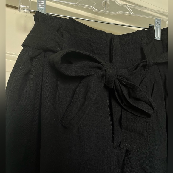 Black business casual pants with ruffle and tie at waist. Size Medium. - Picture 2 of 3